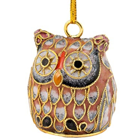 owl shaped hanging ornament in shades of brown with white and black accents.