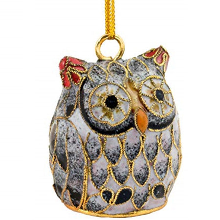 owl shaped hanging ornamet in black, white silver with red ears and a yellow nose.