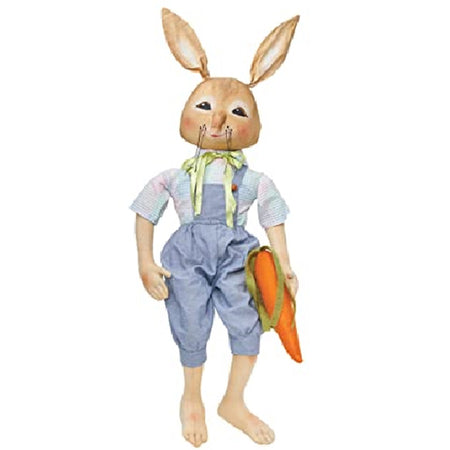 Standing bunny figure. He carries a carrot, wears blue dungaree shorts and matching top, no shoes