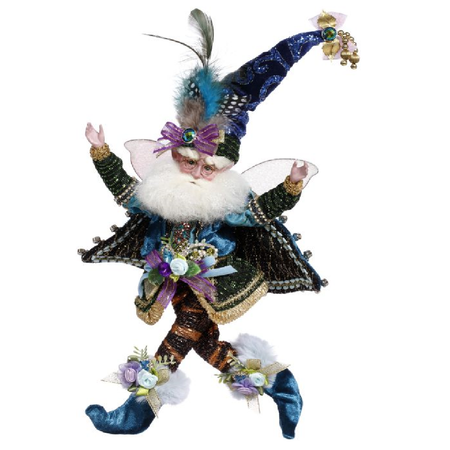 Bearded fairy in a suit of blues, greens and purples, his hat has peacock feathers in it.