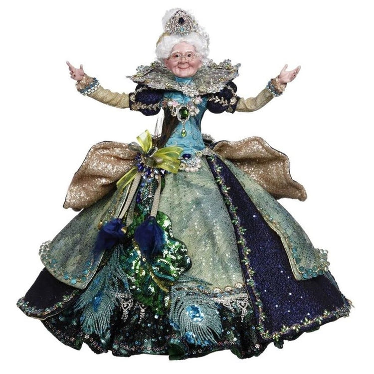 Mrs. Claus figurine dressed in elegant gown in blues and greens, adorned with sequins and peacock feathers.