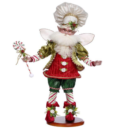 Decorative Fairy figurine holding a peppermint lollipop on a white background