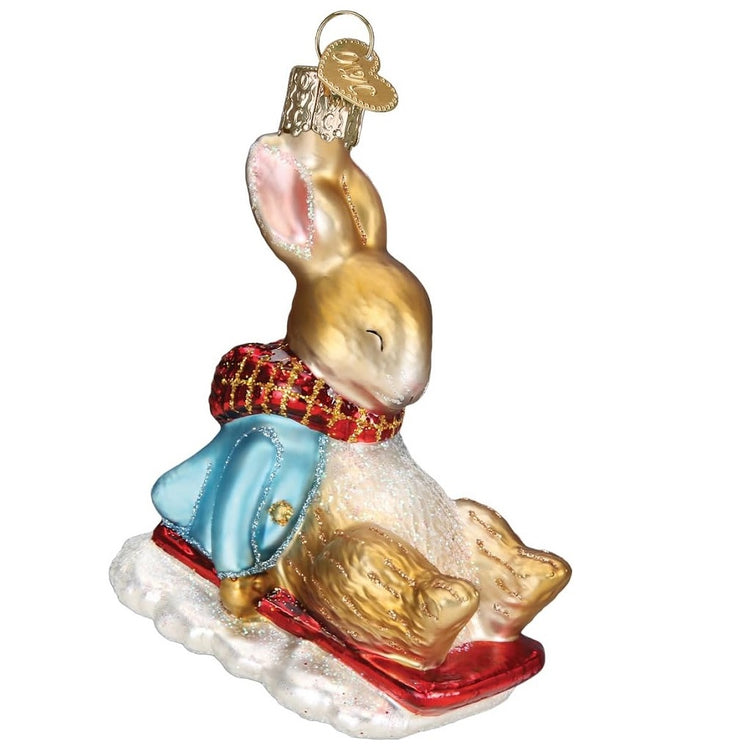 Blown glass Peter Rabbit on a sled ornament.