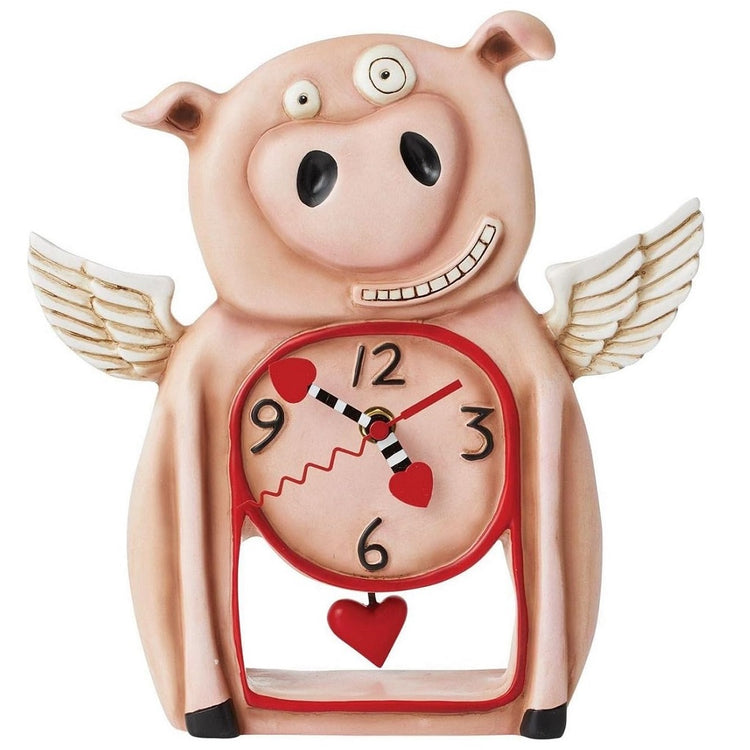 pink piggy desk clock with wings and a pendulum shaped like a red heart.