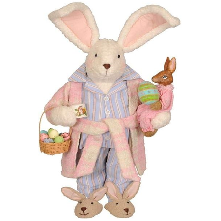 Bunny figurine in pajamas holding a basket of eggs and a baby bunny on a white background