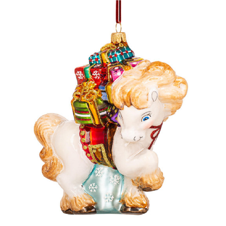 A decorative glass Christmas ornament shaped like a white horse carrying a stack of colorful wrapped gifts, with a red hanging ribbon at the top, shown on a plain white background.
