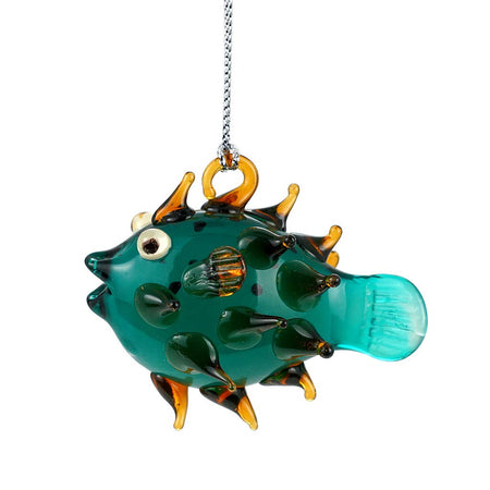 blown glass porcupine fish ornament, the fish is a teal color with golden spikes.