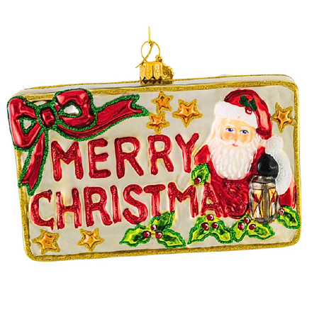 Blown glass postcard inspired ornament, with Santa, a bow, and the words Merry Christmas