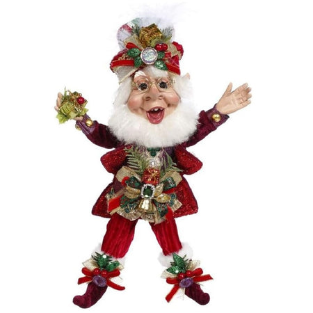 bearded elf wearing red suit with ribbon accents, and holding a small present.