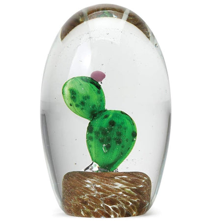 prickly pear cactus in a dome shaped blown glass paperweight.