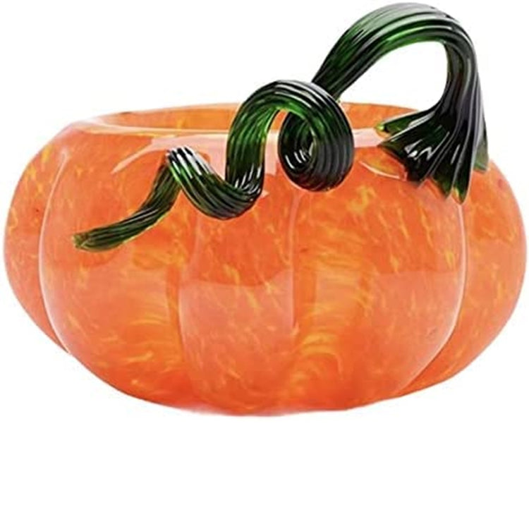 Pumpkin shaped bowl in pumpkin color with a black/green curly vine as the handle