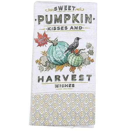 Folded white kitchen towel with yellow print bottom, pumpkins, leaves and Sweet Pumpkin Kisses And Harvest Wishes wording