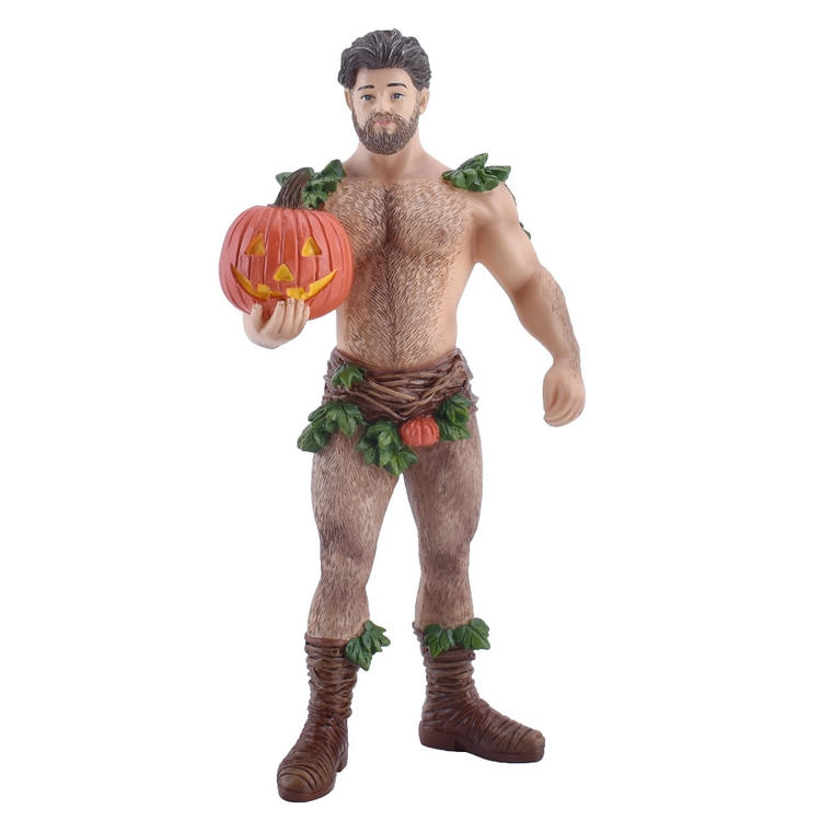 figurine of a man dressed in leaves and vines, with a jack o lantern in one hand.