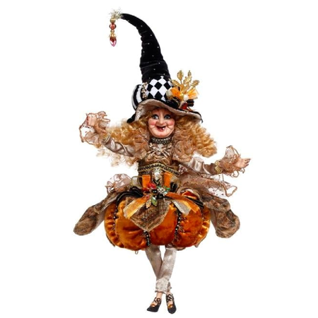 Halloween-themed figurine in witch costume and pumpkin, on a white background
