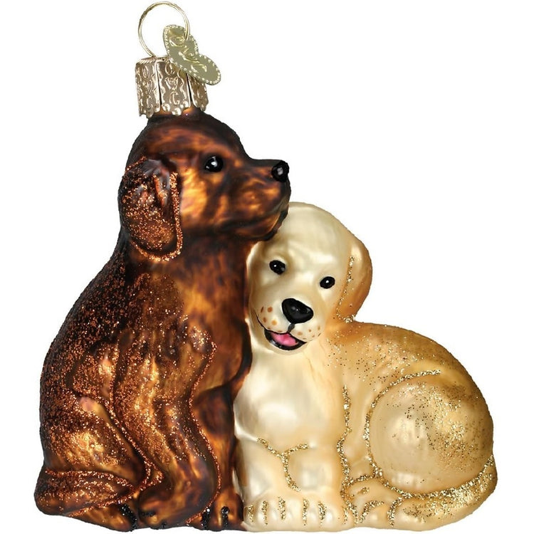 Blown glass hanging ornament of two labrador retrievers, one a yellow lab, and one a chocolate lab.