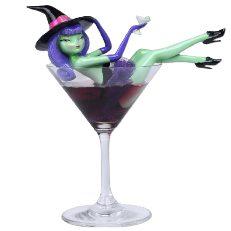 December Diamonds Purple Hair Witch figurine with purple hair and gloves displayed inside a decorative glass martini glass, 8.5 inches high