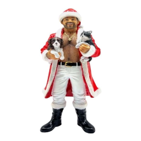 Figurine of a man in Santa Claus outfit holding a puppy and a kitten on a white background
