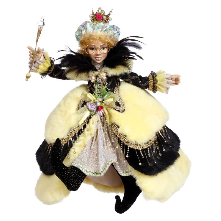 girl elfin in long yellow and black striped fur dress, holding a wand and wearing a crown.