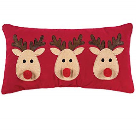 Red oblong pillow with 3 duplicate reindeers with tan faces, brown antlers and a red puff ball nose.