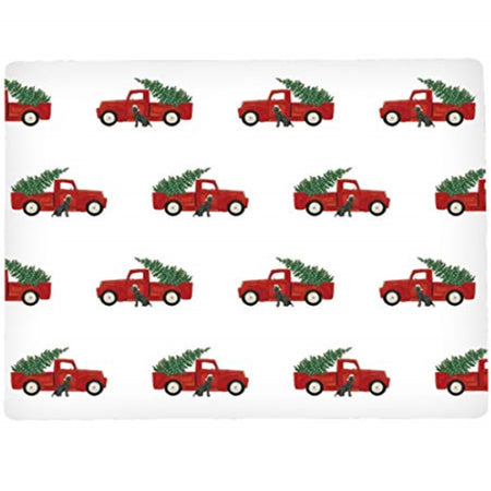 rectangle shaped placemat with repeating pattern of a red pick up truck, green tree in the back and a black lab sitting outside by the passenger door.