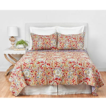 Photo shows bedroom but the item for sale is the bed quilt which is red and gold paisley with a tough of teal. Reverses to stripes of same color. 2 matching shams.