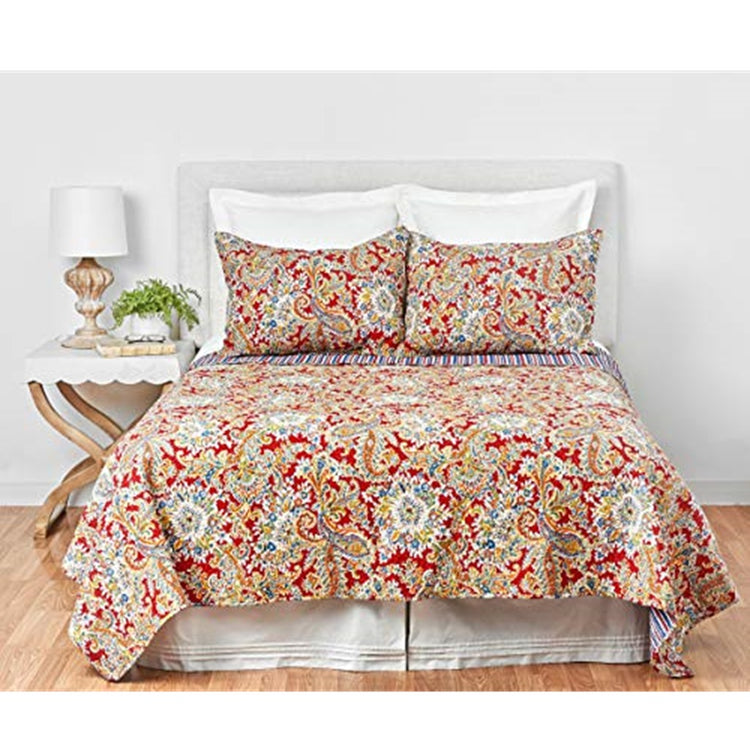 Photo shows bedroom but the item for sale is the bed quilt which is red and gold paisley with a tough of teal. Reverses to stripes of same color. 2 matching shams.