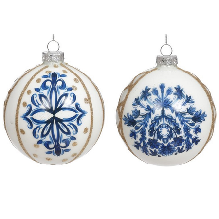 two white blown glass ornaments with gold glitter accents, and intricate blue details.