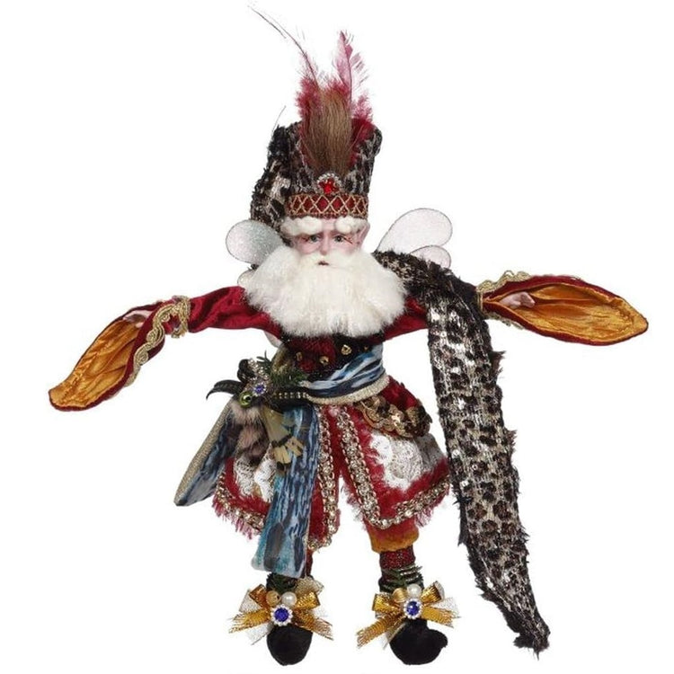 fairy figure wearing a safari type outfit with leopard print scarf, feathers, etc.