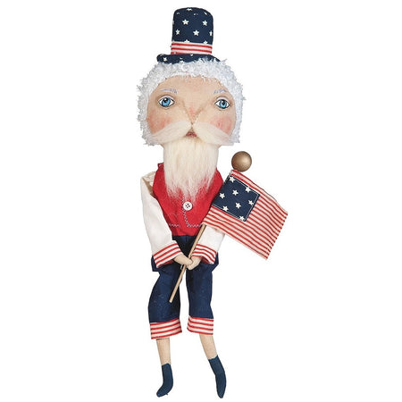 Fabric doll figurine made to look like Uncle Sam in a red vest, blue pants, a star patterned top hat and holding a hand made flag.