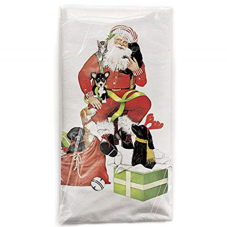 White Kitchen Towel with Santa sitting on a stool holding 2 puppies and a cat. Sack of presents with a puppy inside and a box with a puppy inside.