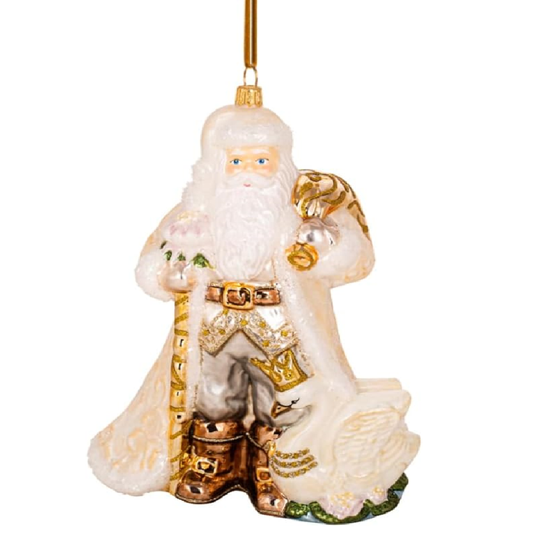 Blown glass santa ornament wearing white and gold outfit with a white swan next to him.