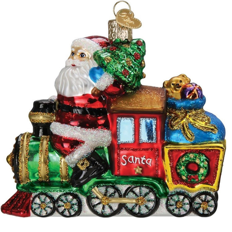 blown glass santa riding on a locomotive ornament.