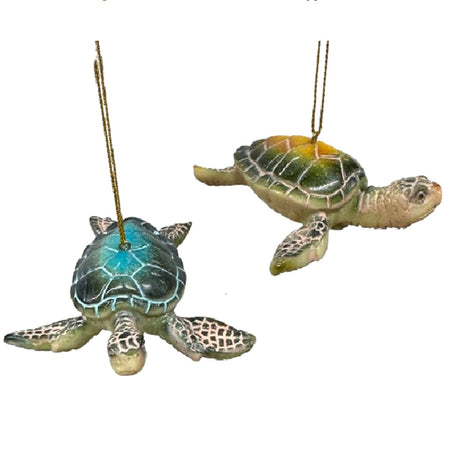 2 ornaments shaped like sea turtles, one has a blue shell and one is green/brown