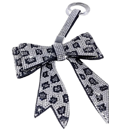 purse charm or key chain shaped like a bow with silver leopard rhinestone pattern.