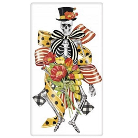 white flour sack towel with an image of a skeleton with different halloween ribbons, and orange flowers, wearing a top hat.