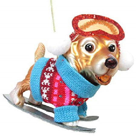 ornament shaped like a golden dog wearing a ski sweater and googles in ski's.