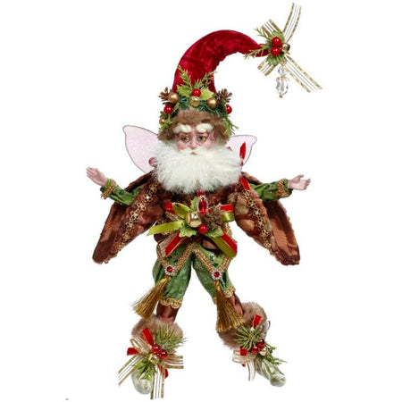 fairy figure with tall red hat, berries, bells and gold ribbon on hat choes and belt. Green pants and booties