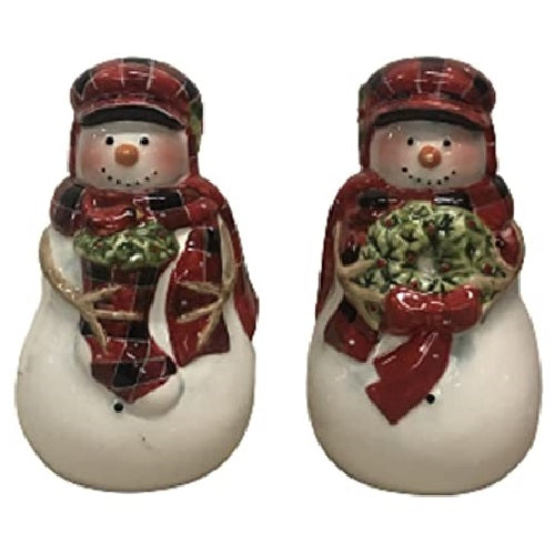 Salt and Pepper shakers in the shape of 2 snowman in white with red plaid hats and matching scarves. One carries a stocking and one a wreath.