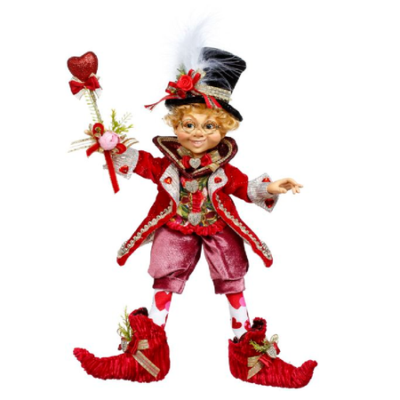 Elfin boy figurine wearing all pink and red, he's holding a wand with a heart at the top.