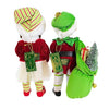 back view of 2 standing elf figures, 1 boy and one girl. The girl holds a peppermint lollipop the boy a bag of gifts . Shows the Karen Didion tags.