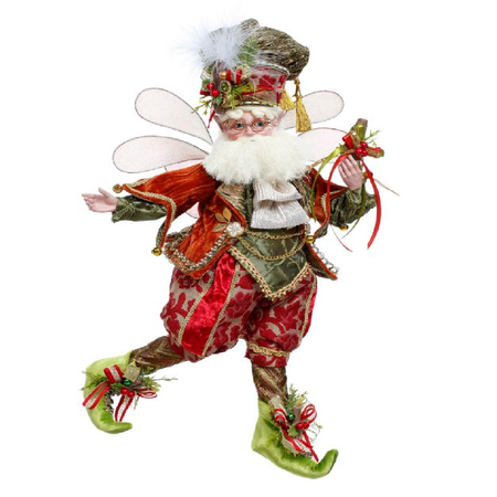 Bearded fairy wearing orange, red and green outfit with berry and cinnamon stick accents.