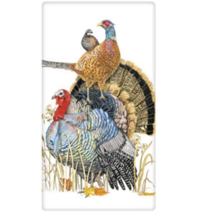 White towel with a turkey and a pheasant on his back and another bird on the pheasant
