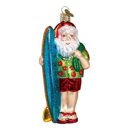 Ornament shaped like Santa in red bathing trunks, a green Hawaiian shirt with red flowers, towel over his shoulder holding a blue surfboard