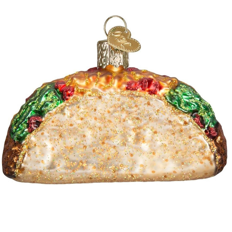 Blown glass taco ornament with glitter accents.
