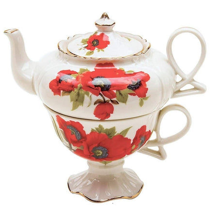 White tea for one with red poppy design. Handles are very ornate, gold edge.