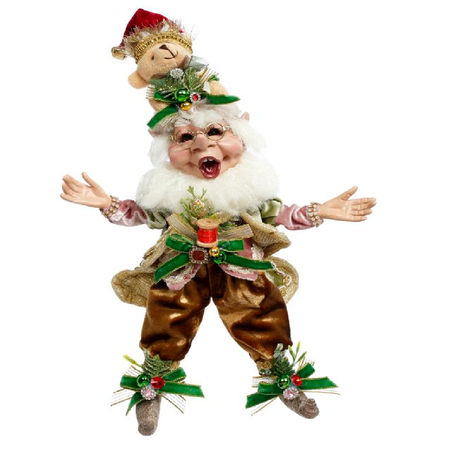 bearded elf wearing brown outfit with ribbons, and a hat made of a teddy bear.