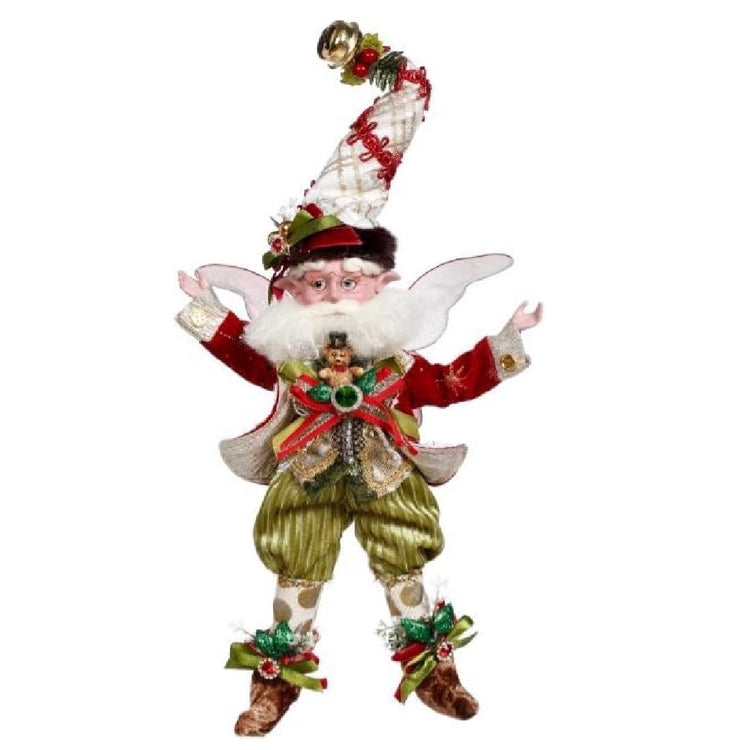 bearded fairy in green pants, red jacket and a white plaid stocking cap. he's got ribbon and teddy bear accents.