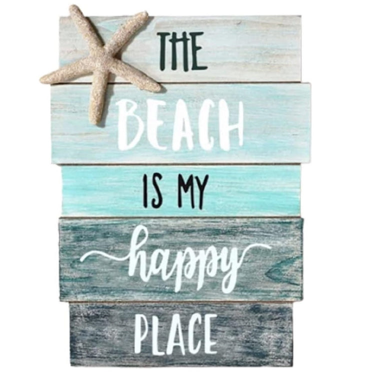 wooden slat sign painted in shades of blue, a starfish accent, and the saying "the beach is my happy place"