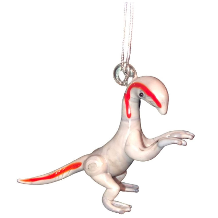 Blown glass ornament greyish white dinosaur with a bright orangey red stripe on tail and face.