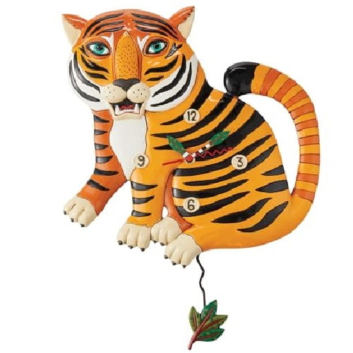 wall clocked shaped like a sitting tiger, orange with black stripes. Green leaf pendulum